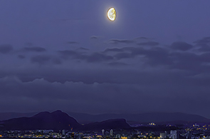 Moon over the city of Edinburgh from Fife